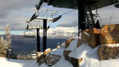 Empty chair lift during midweek skiing