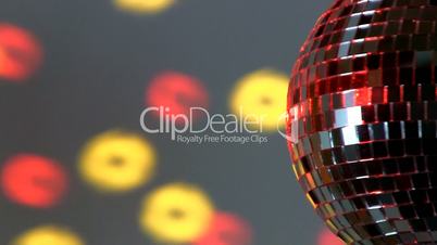 Half mirror ball; red and yellow light