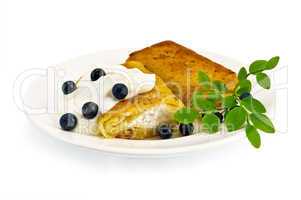 Pancakes with cottage cheese and blueberries on the plate