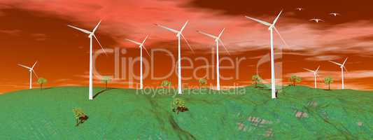 Wind turbines in nature by sunset
