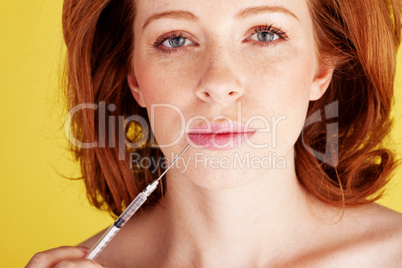 Woman Holding Hyperdermic Needle