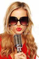Gorgeous Blonde In Sunglasses With Microphone