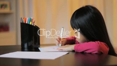 Little Girl Coloring With A Felt Marker