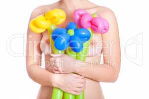 Naked woman with flower balloons