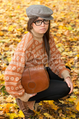 Sad young girl with handbag