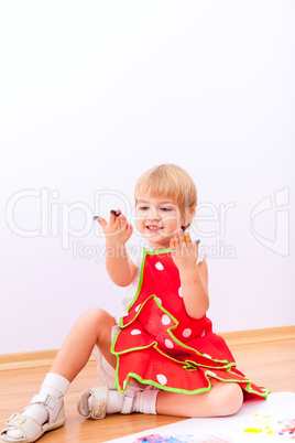 Little girl with paint on her hands