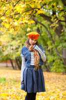 Cheerful girl in orange beret