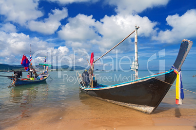 Long thai boat on sand beach