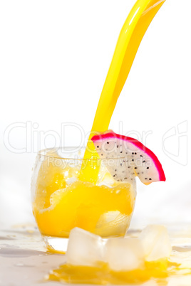 Orange juice in glass with pitaya slice