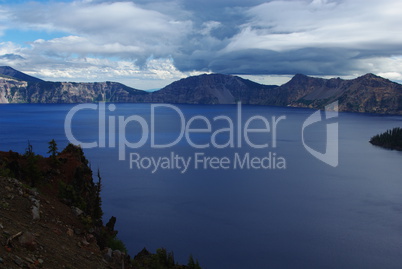 Deep blue Crater Lake and clouds