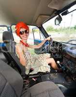 Vintage cheerful girl driving retro car
