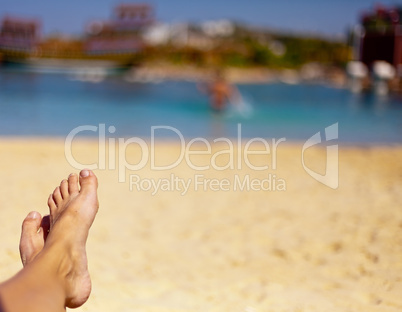 sandy feet on the beach