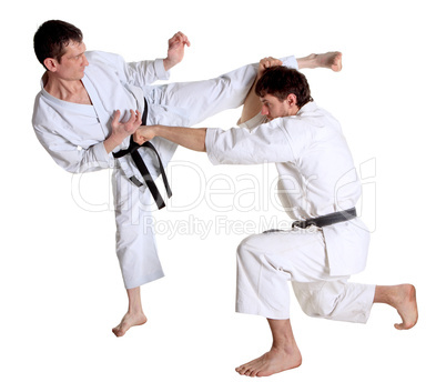 Karate. Men in a kimono with a white background