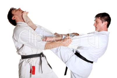 Karate. Men in a kimono with a white background