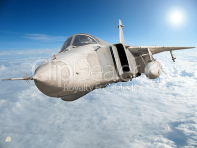 Military jet bomber Su-24 Fencer flying above the clouds.