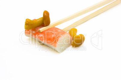 sushi on chopstick with mushrooms