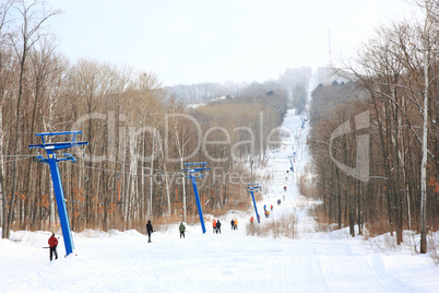 Skiers go on the lift on mountain in Primorski Territory Russia