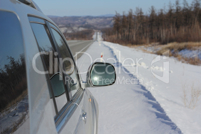 Car on winter road.