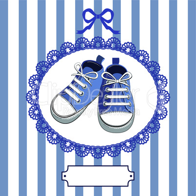 Blue baby shoes and frame