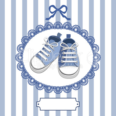 Blue baby shoes and frame