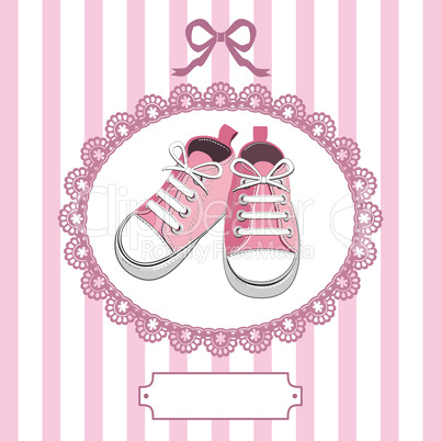 Pink baby shoes and lace frame