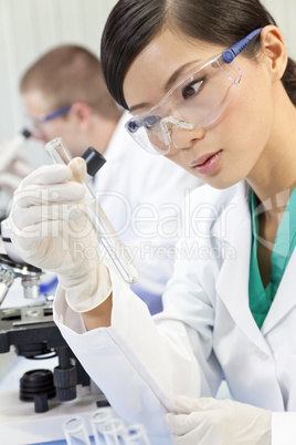 Chinese Female Woman Scientist With Test Tube In Laboratory