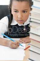 African American School Girl Writing In Class