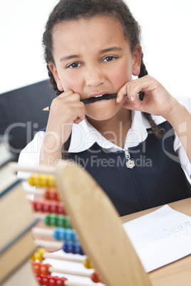 African American School Girl In Class Writing & Abacus