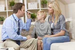 Male Doctor Home Visit Examining Boy Child With Mother