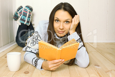 Young woman reads a book