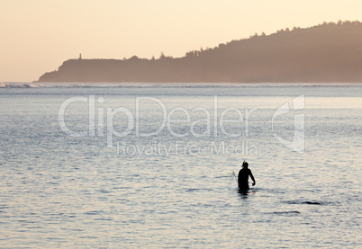 Misty sunrise with snorkler