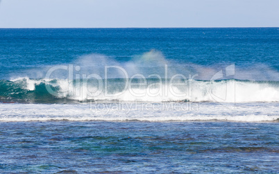 Rainbow colors in spray from waves