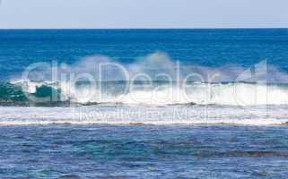 Rainbow colors in spray from waves