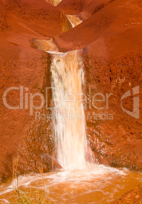 Cascading river in dry red rocks