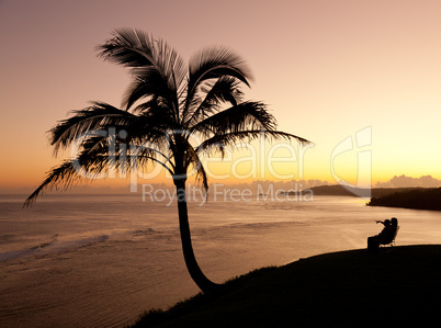 Couple watching sunrise in Kauai