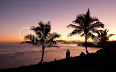 Couple watching sunrise in Kauai