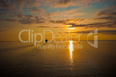 cruise liner in the sea at sunset