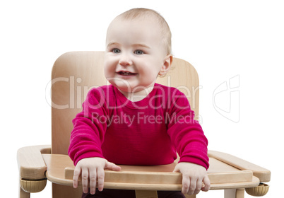 young child sitting in high chair