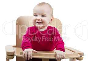 young child sitting in high chair