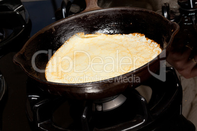 Frying pancake mix into pan