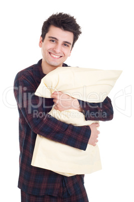 Man in pajamas holding pillow