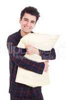 Man in pajamas holding pillow