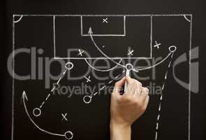 Man drawing a soccer game strategy