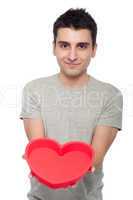 Casual man holding heart