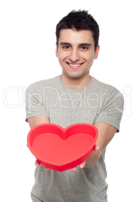 Casual man holding heart