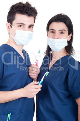 Doctors team with toothbrush