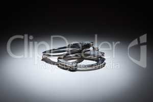 Abstract Pair of Handcuffs Under Spot Light