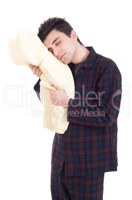 Man in pajamas holding pillow