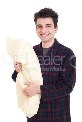 Man in pajamas holding pillow