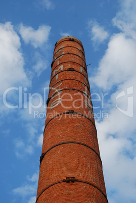 Tall Brick Chimney (Dismantled Industry) with blue sky background